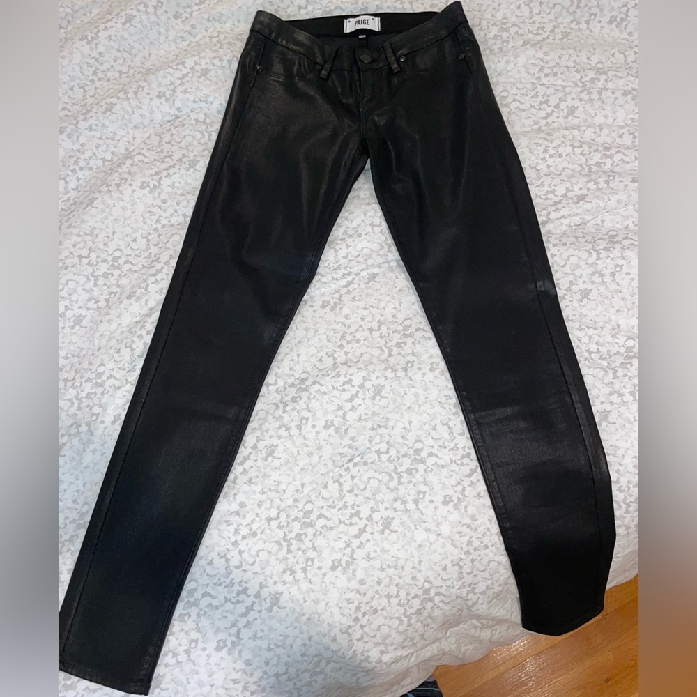 Coated black skinny jeans